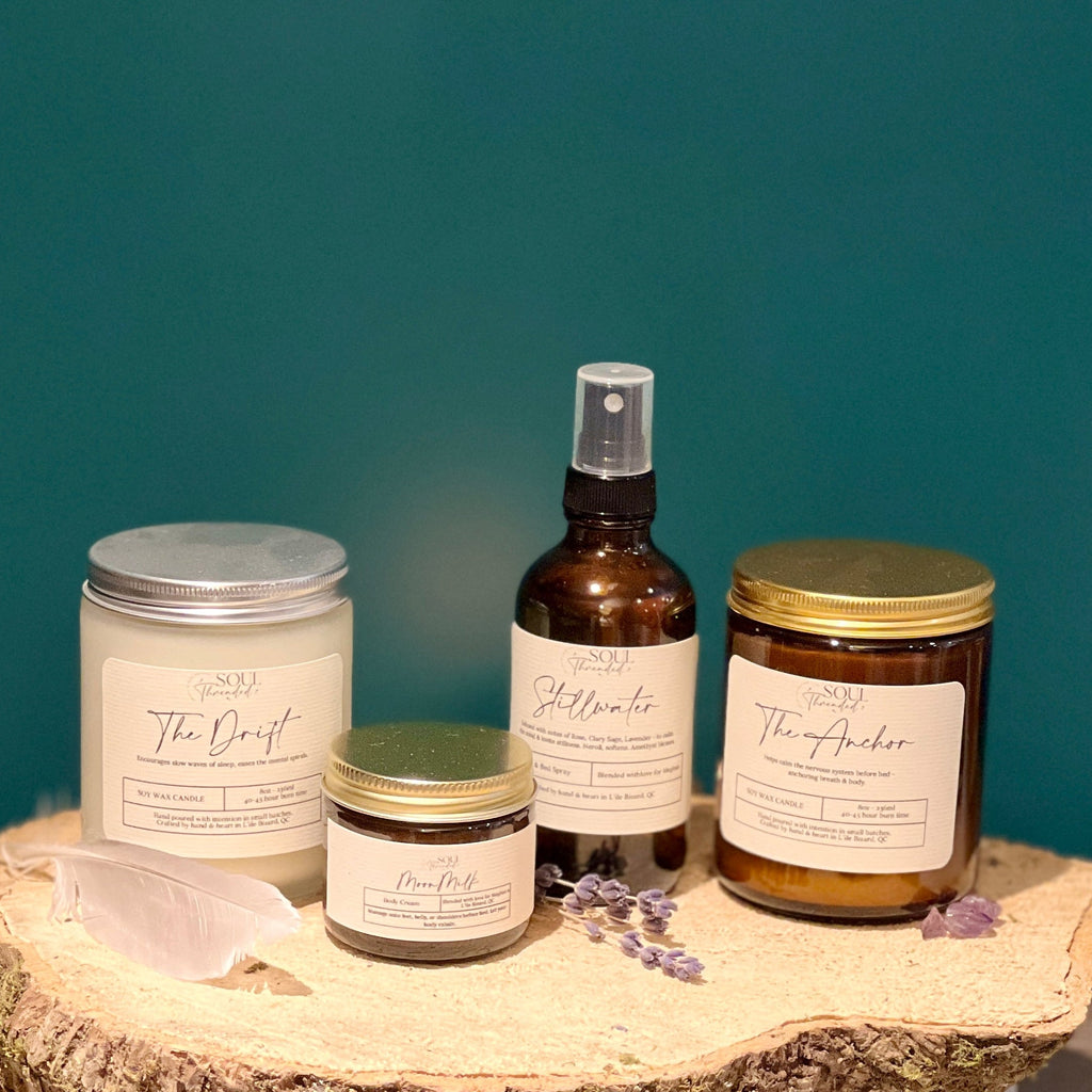 Collection of skincare products on a wooden surface with a teal background